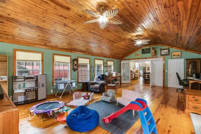 a very nice looking room with lots of furniture and a large window