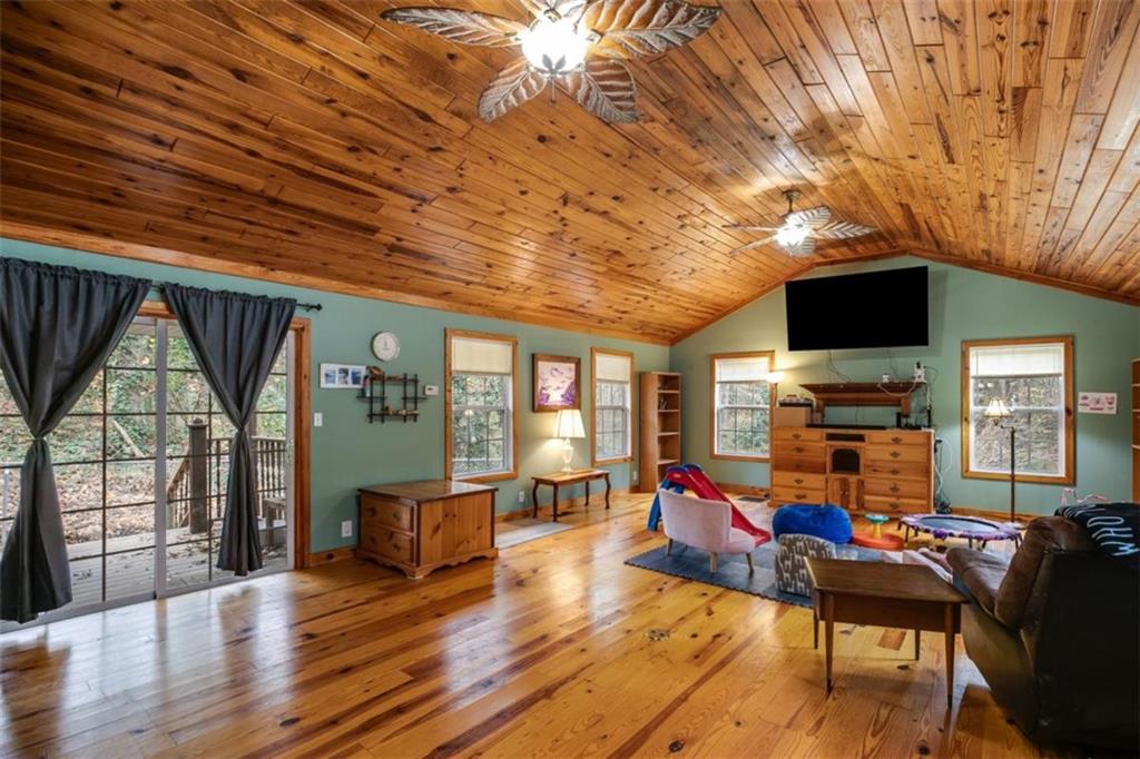 809 Laurel Street Bremen, GA 30110 - Photo 7 of 34 a living room with furniture a fireplace and a flat screen tv
