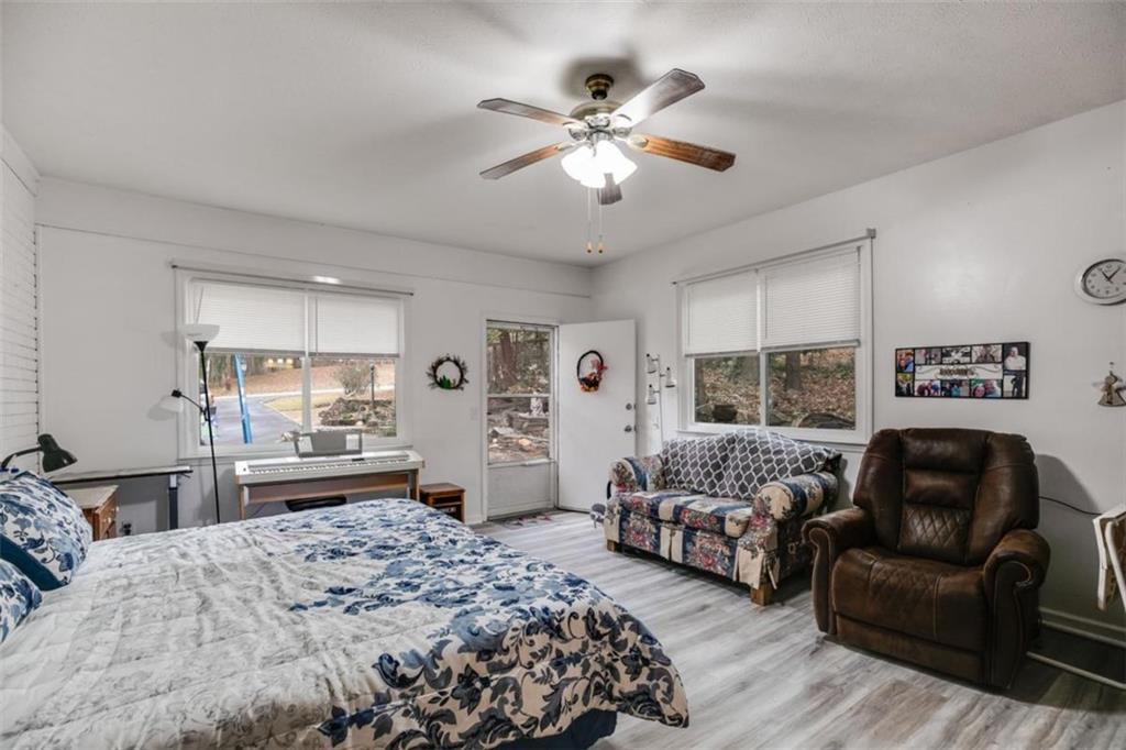 809 Laurel Street Bremen, GA 30110 - Photo 9 of 34 a spacious bedroom with a bed and a couch