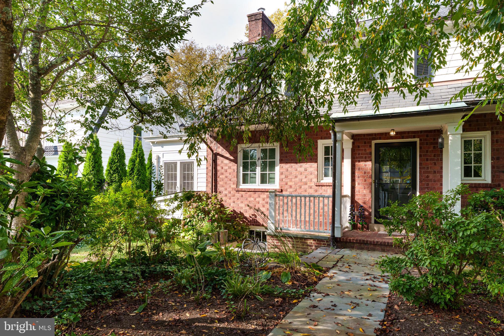 front view of a house with a tree