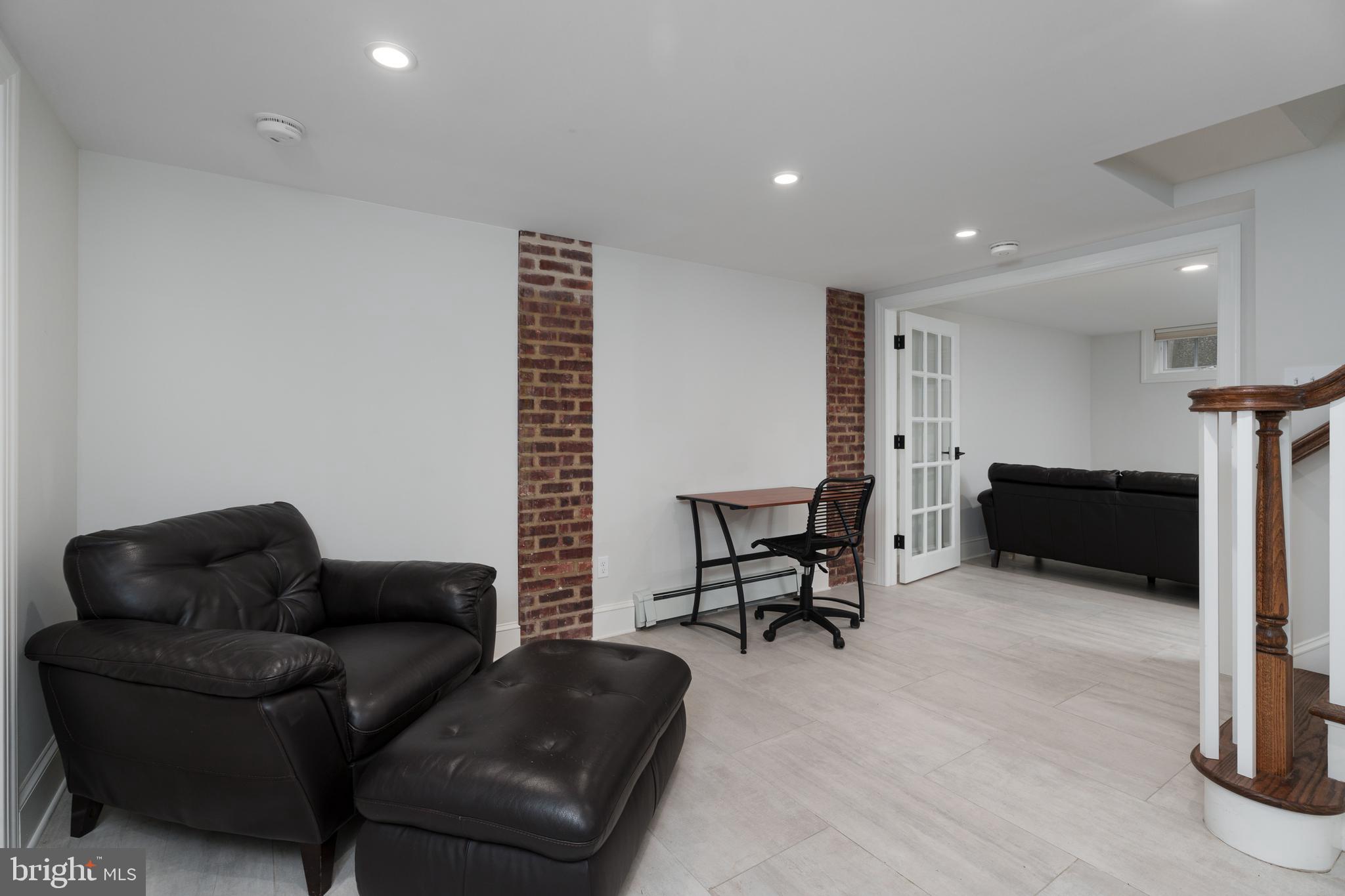 109 Moore Street Princeton, NJ 08540 - Photo 12 of 26 a living room with furniture and a fireplace