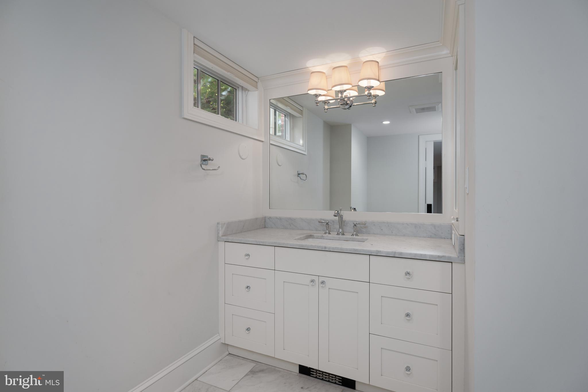 109 Moore Street Princeton, NJ 08540 - Photo 17 of 26 a bathroom with a sink and a mirror