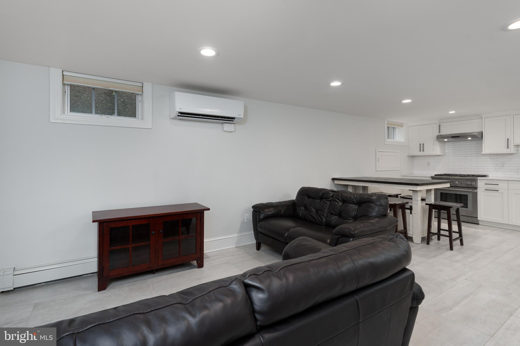 109 Moore Street Princeton, NJ 08540 - Photo 8 of 26 a living room with furniture and a flat screen tv