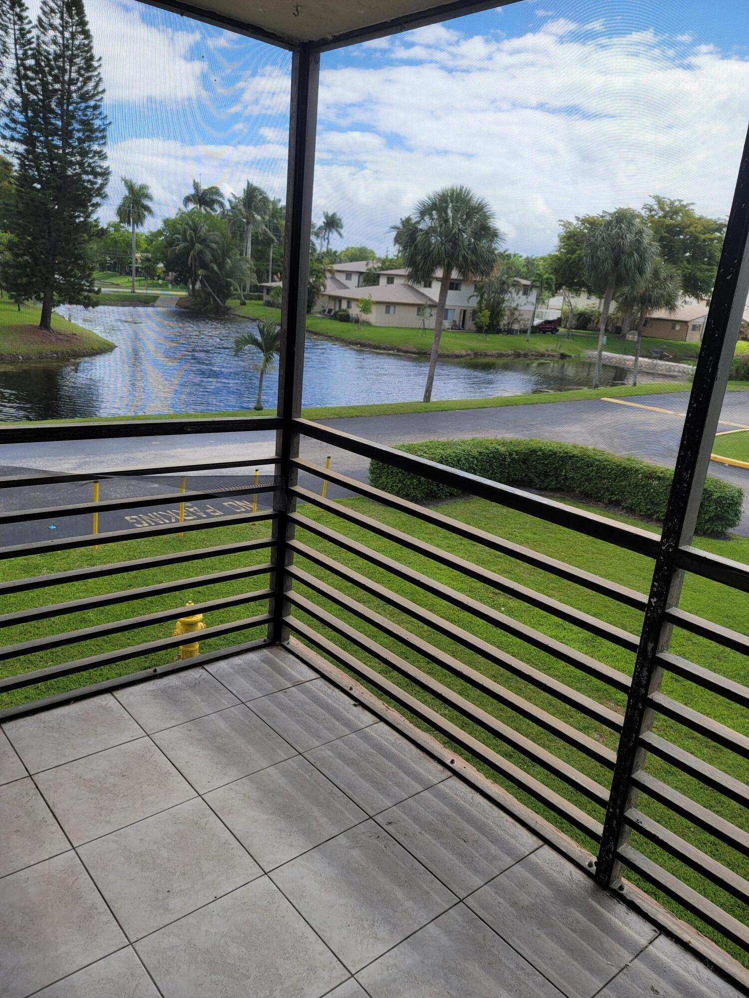 3700-3730 North Pine Island Road, Unit 249 Sunrise, FL 33351 - Photo 15 of 18 a view of lake from a balcony