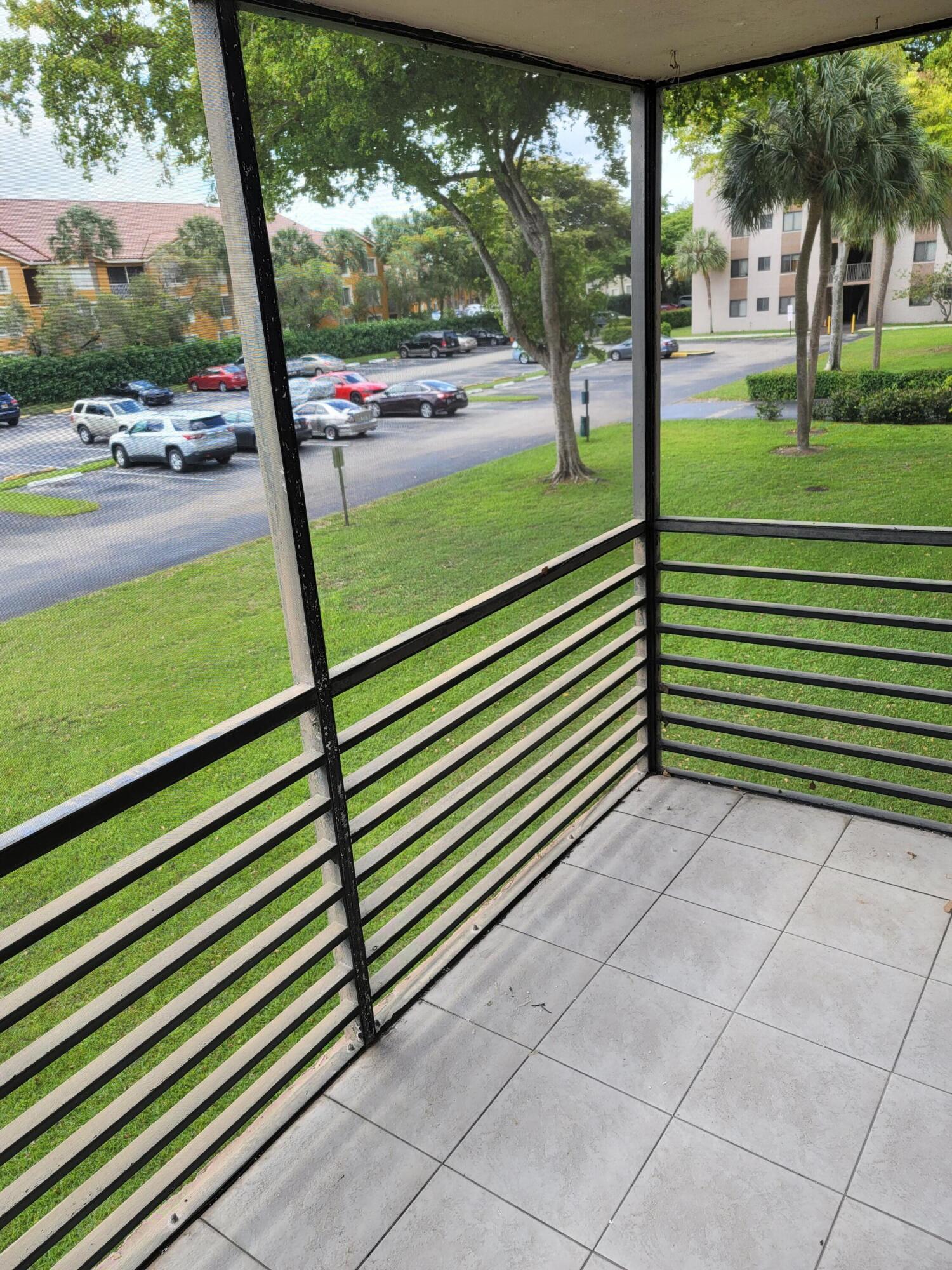 3700-3730 North Pine Island Road, Unit 249 Sunrise, FL 33351 - Photo 17 of 18 a view of a yard with porch and outdoor space