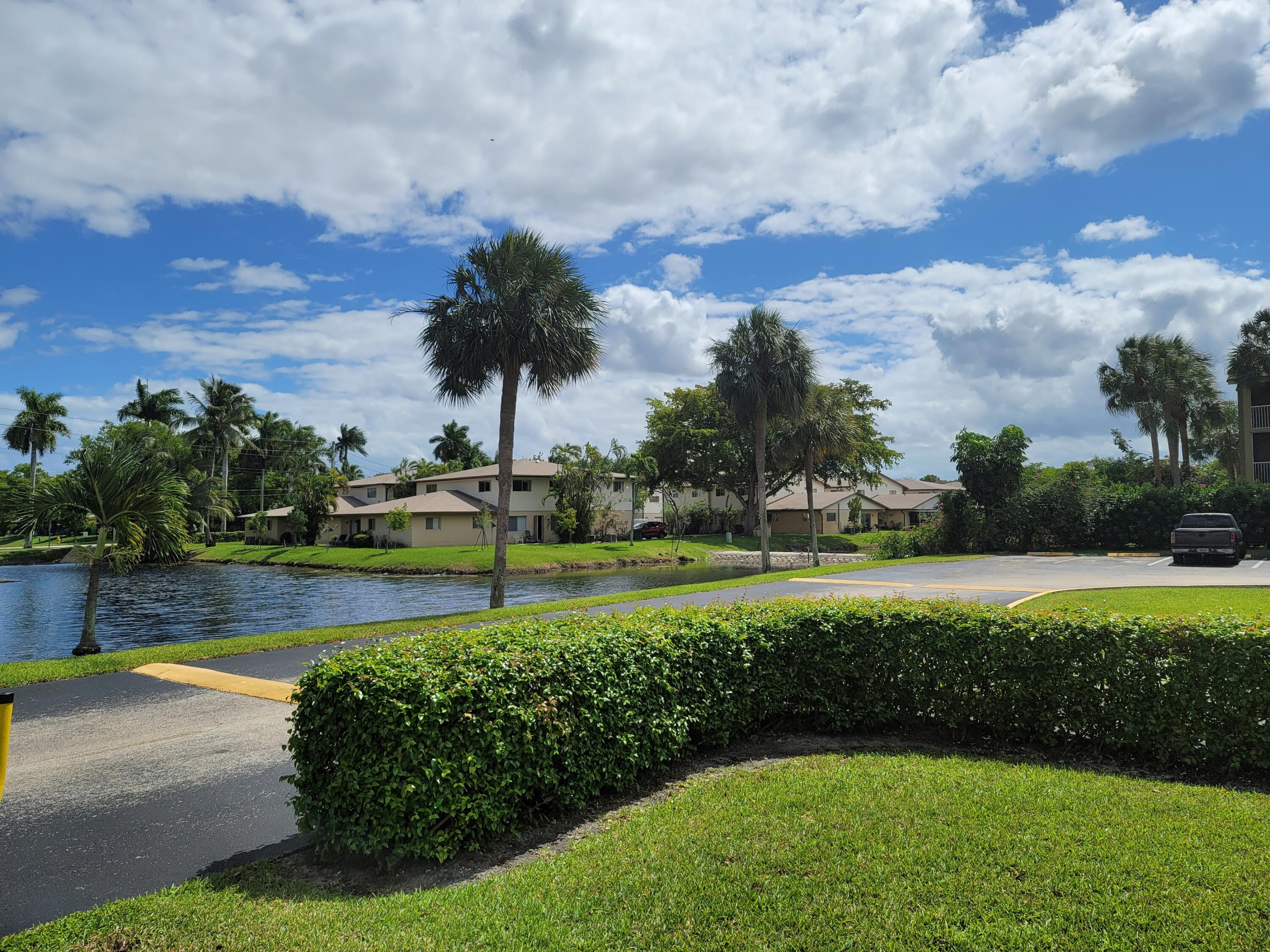 3700-3730 North Pine Island Road, Unit 249 Sunrise, FL 33351 - Photo 18 of 18 a view of an outdoor space and swimming pool