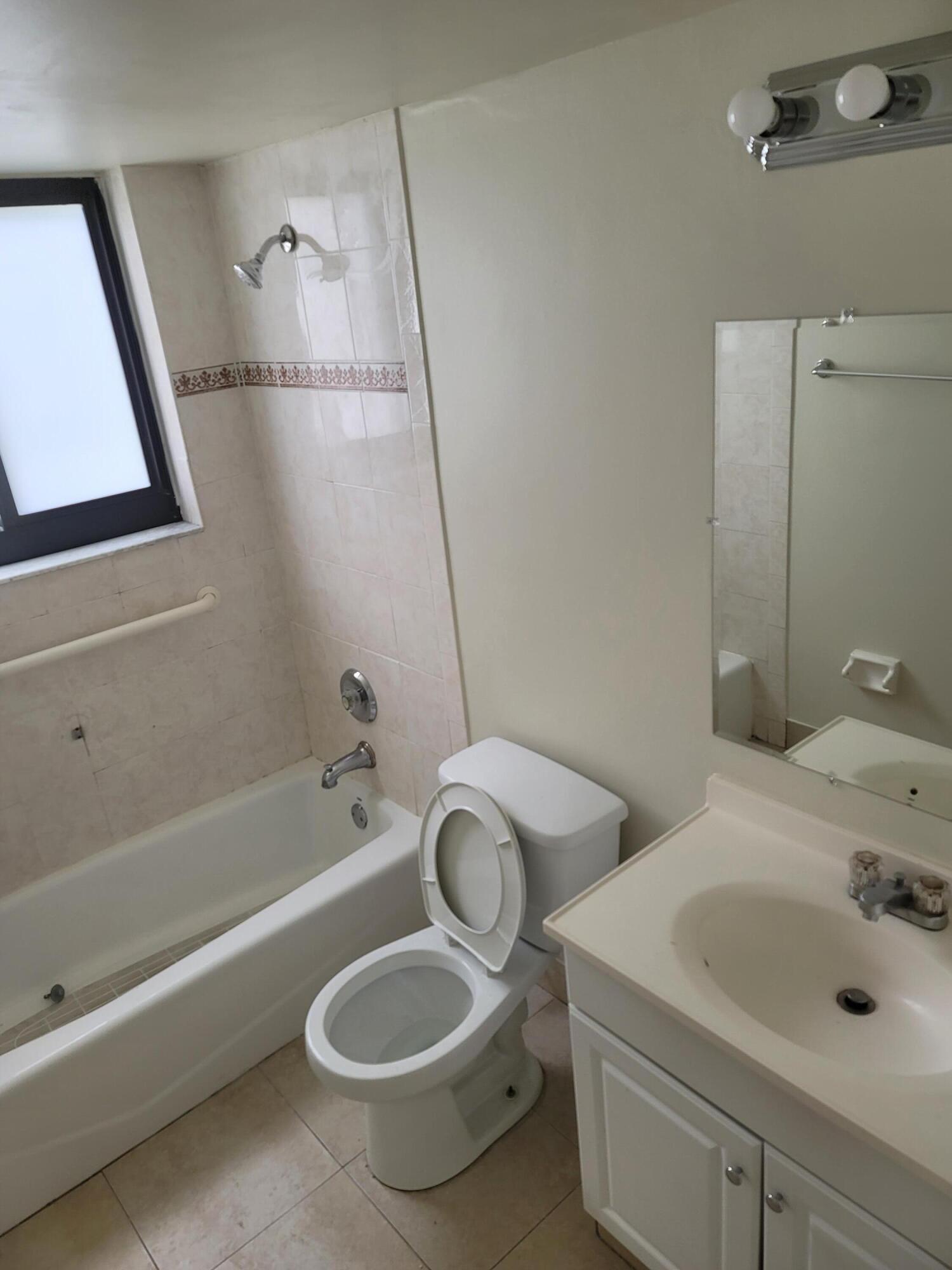 3700-3730 North Pine Island Road, Unit 249 Sunrise, FL 33351 - Photo 7 of 18 a bathroom with a sink toilet and shower