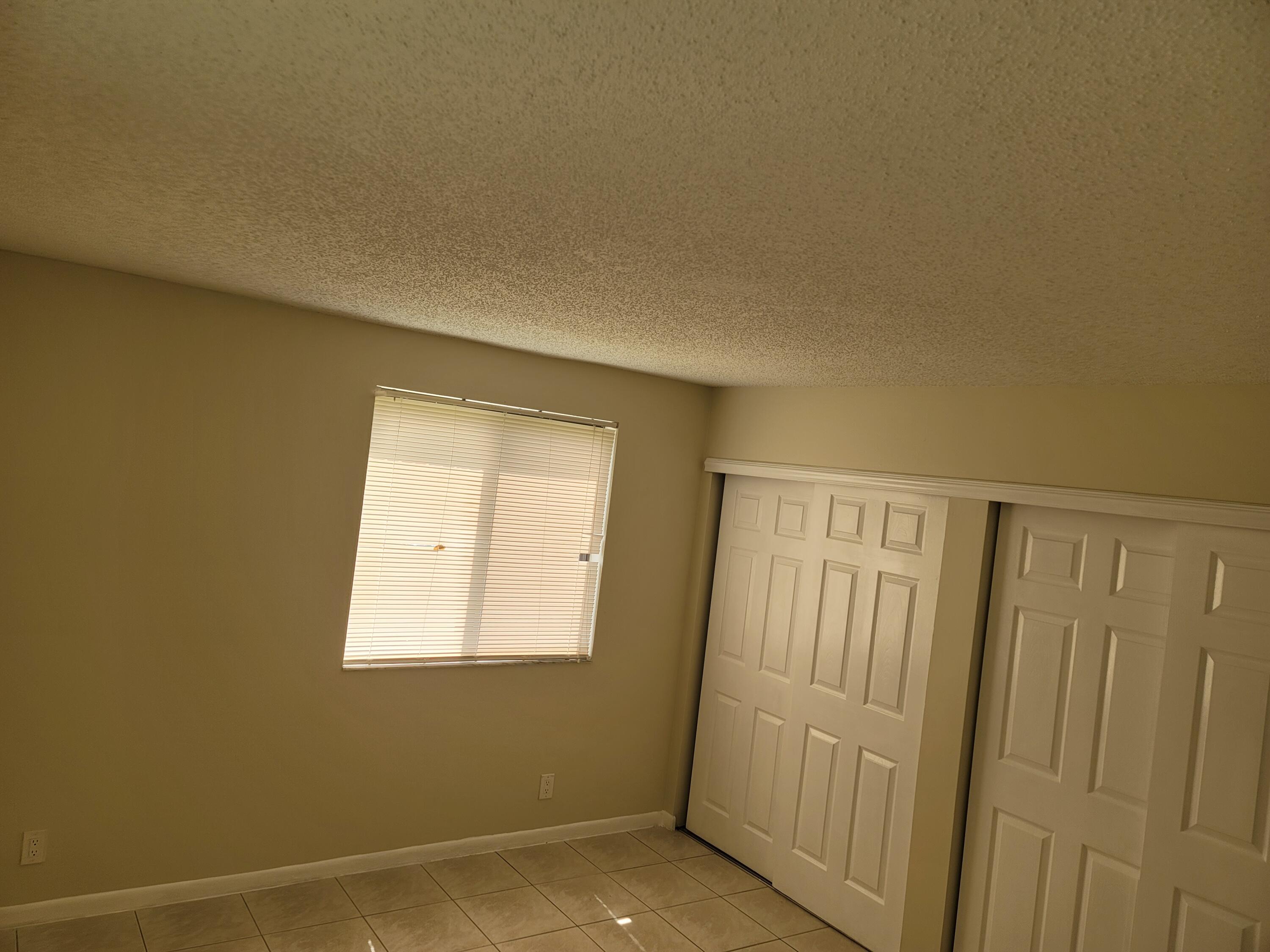 3700-3730 North Pine Island Road, Unit 249 Sunrise, FL 33351 - Photo 8 of 18 a view of an empty room with a window