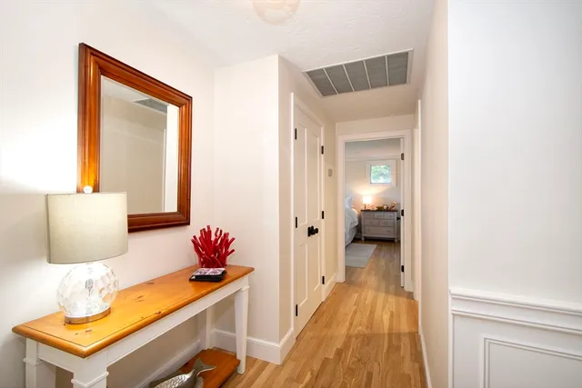 a en suite bathroom with a granite countertop sink and a mirror