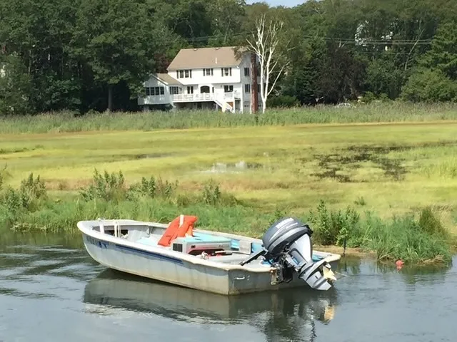 a view of a lake with a table and chairs