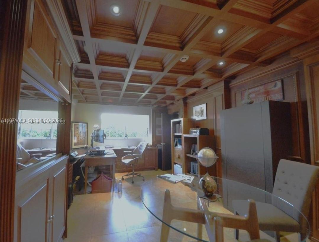 510 Bird Road Coral Gables, FL 33146 - Photo 3 of 9 a room with table or chairs and a refrigerator