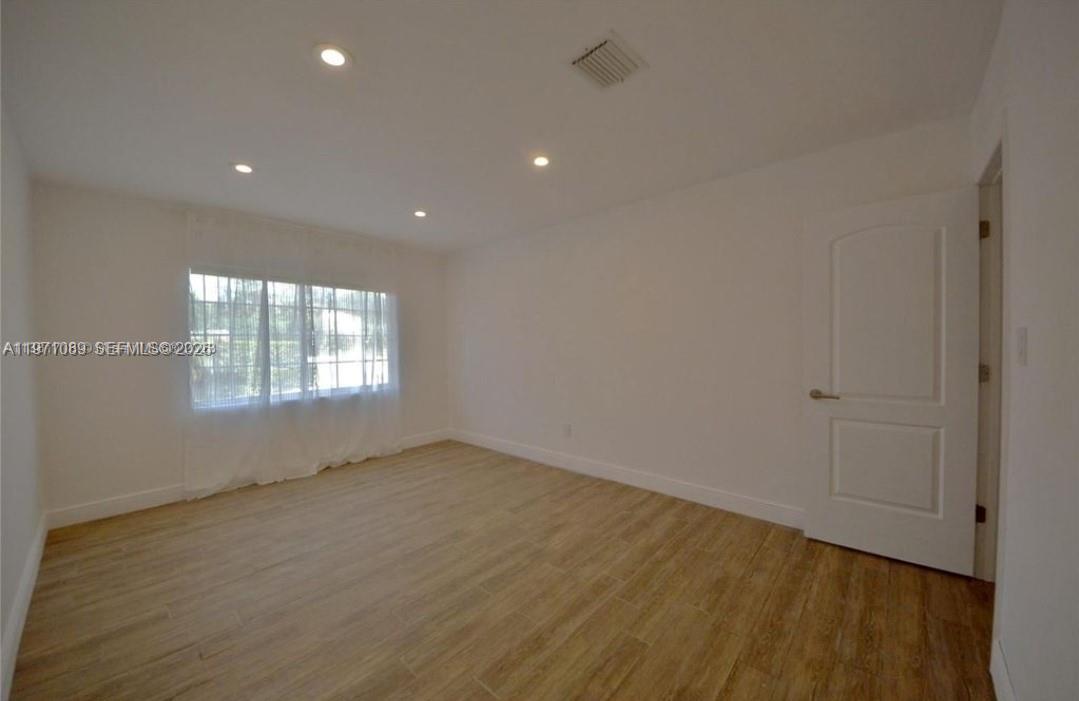 510 Bird Road Coral Gables, FL 33146 - Photo 5 of 9 a view of an empty room with a window