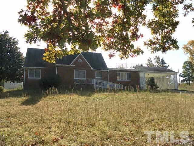 4700 Virgilina Road Roxboro, NC 27574 - Photo 1 of 3 a front view of a house with a yard