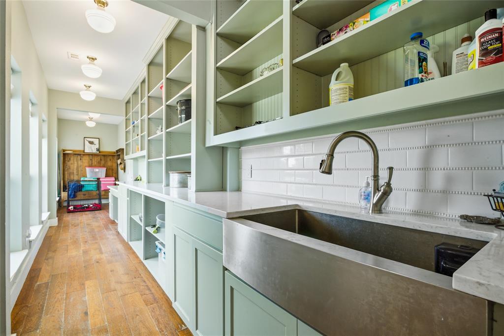 1073 Gordonville Road Gordonville, TX 76245 - Photo 20 of 38 A huge Butler's Pantry will amaze you! Equipped with a large stainless farm sink and all the cabinets and storage you can imagine, it's love at first site. At the end of this room, a mudroom provides space for shoes and coats when coming in from the garage.