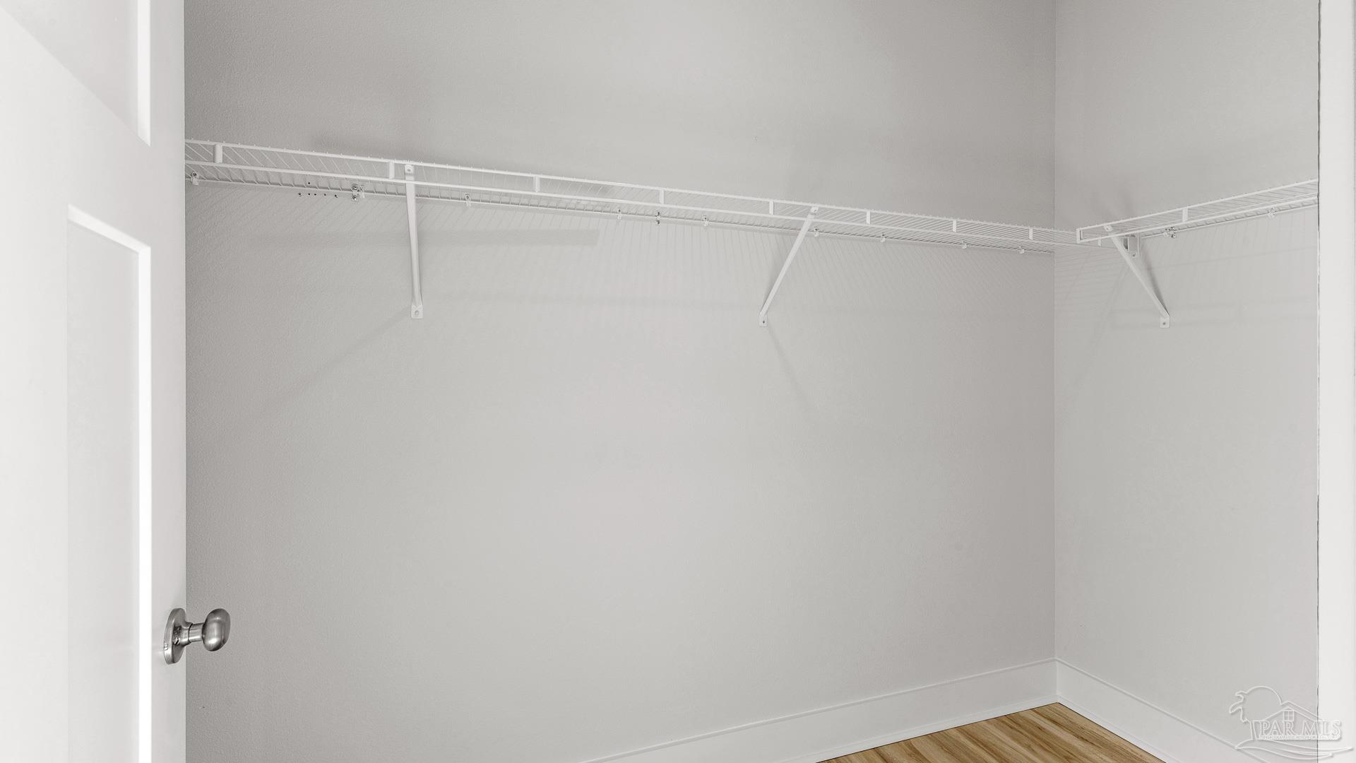 3223 Water Birch Road Cantonment, FL 32533 - Photo 21 of 44 a view of a room with racks on the wall