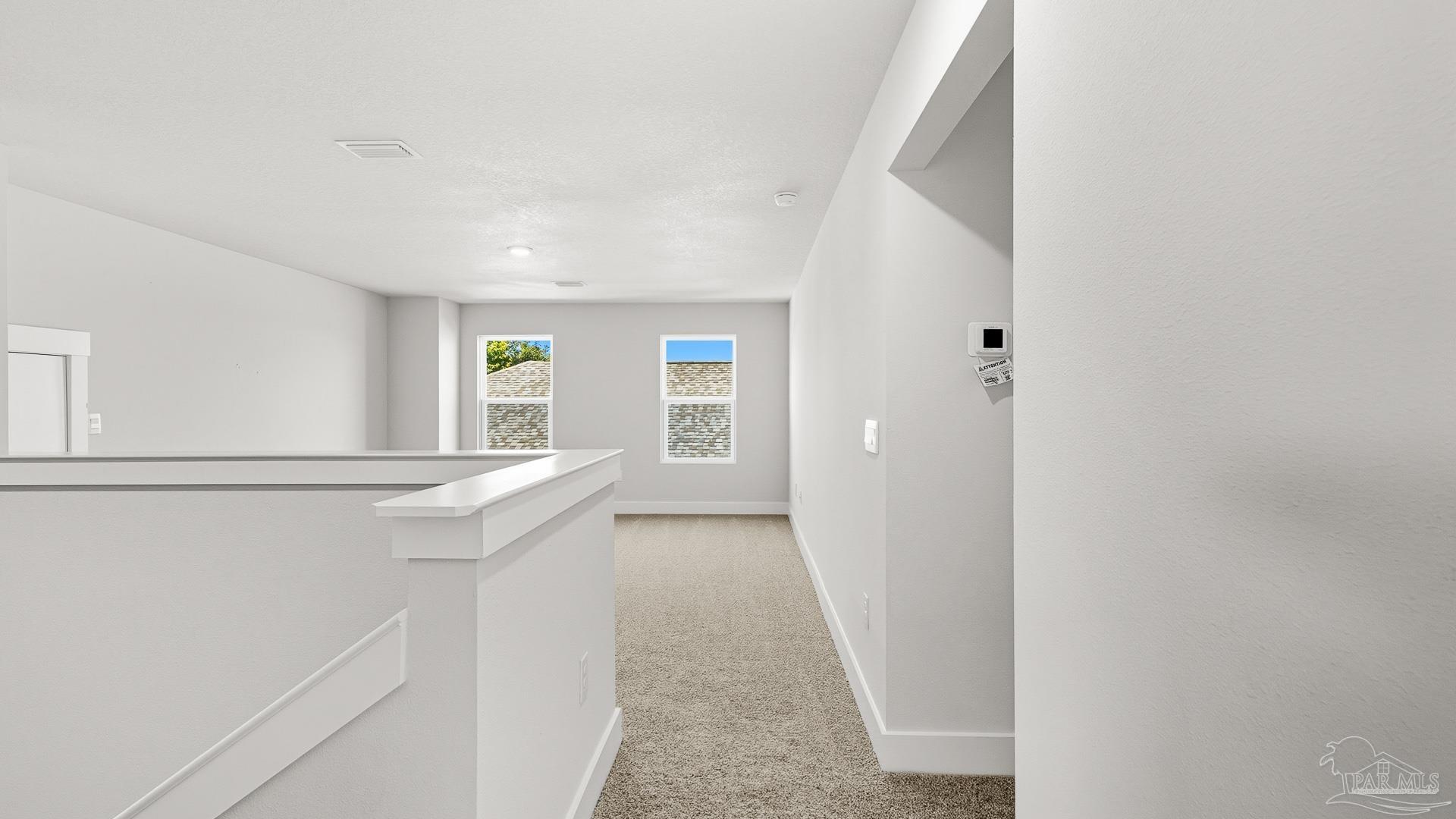 3223 Water Birch Road Cantonment, FL 32533 - Photo 25 of 44 a view of hallway with window and wooden floor