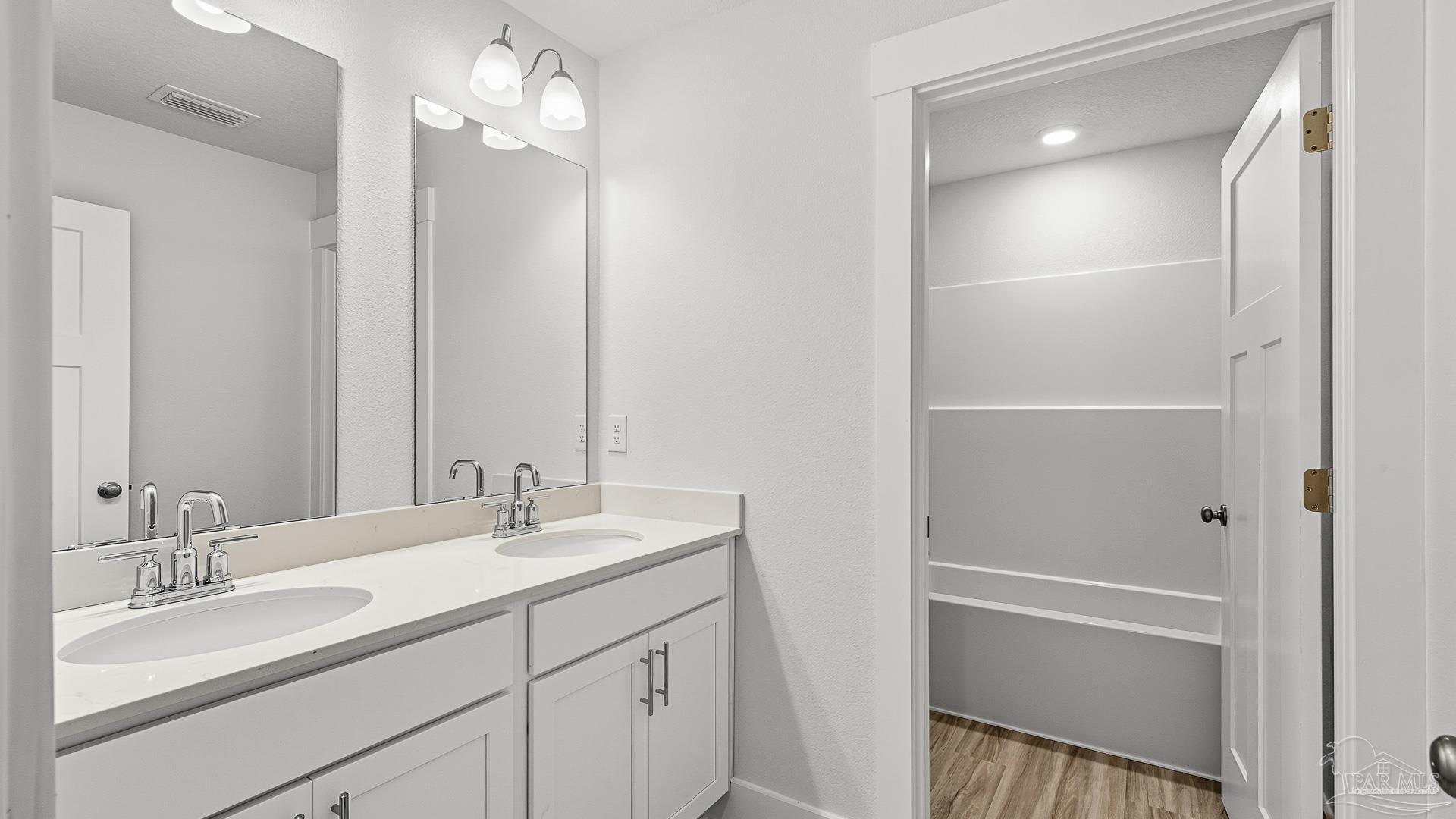 3223 Water Birch Road Cantonment, FL 32533 - Photo 31 of 44 a bathroom with a sink double vanity and a mirror