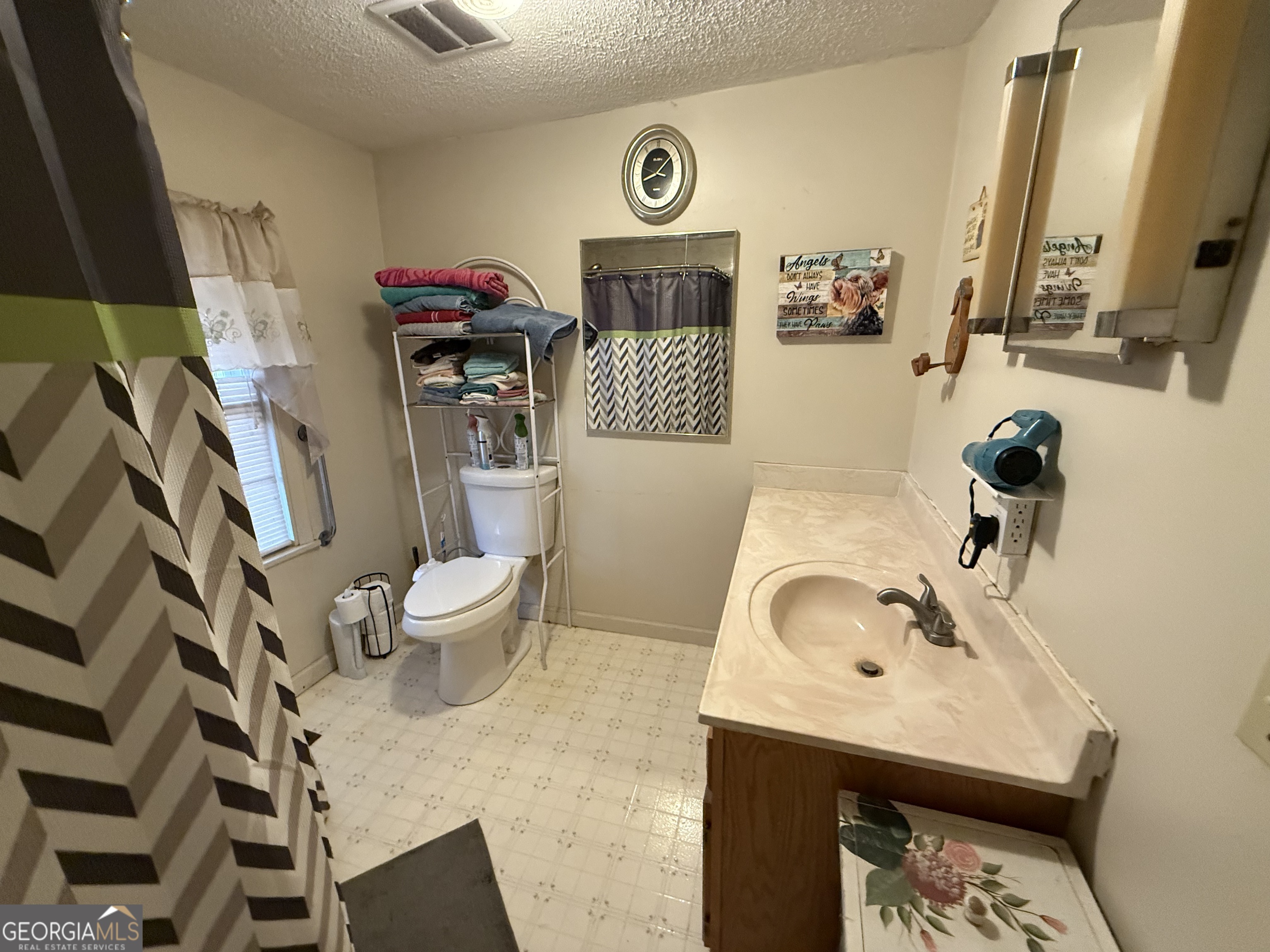 1769 Payne Road Rentz, GA 31075 - Photo 21 of 33 a bathroom with a sink toilet and shower