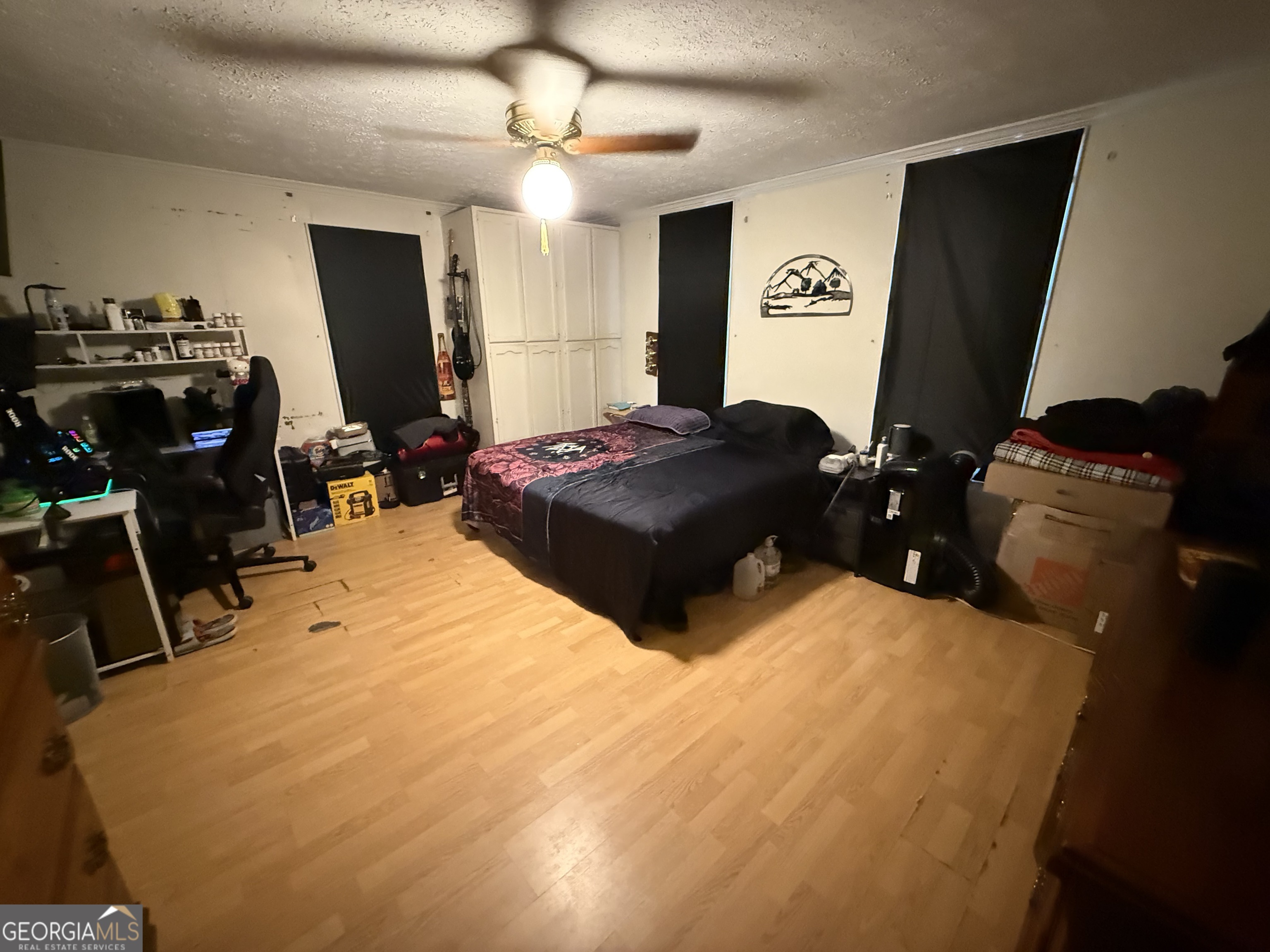 1769 Payne Road Rentz, GA 31075 - Photo 23 of 33 a bedroom with a bed and a flat tv screen on dresser