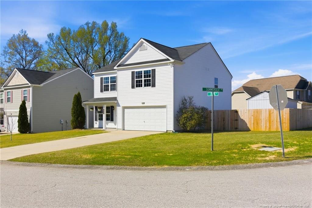 334 Crane Way Bunnlevel, NC 28323 - Photo 4 of 45 a view of a house with a backyard and tree