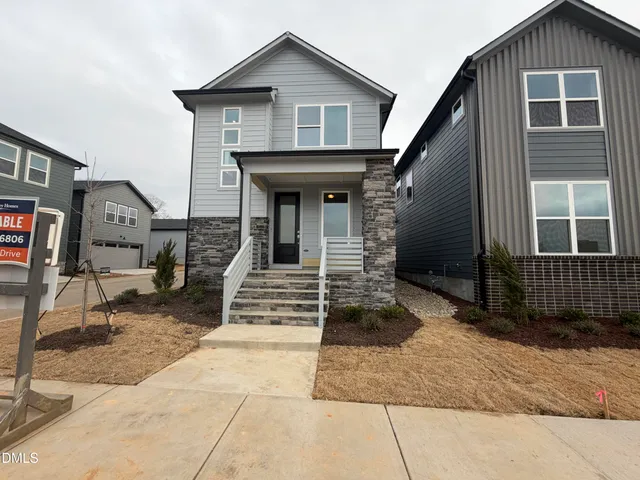 a front view of a house with garage