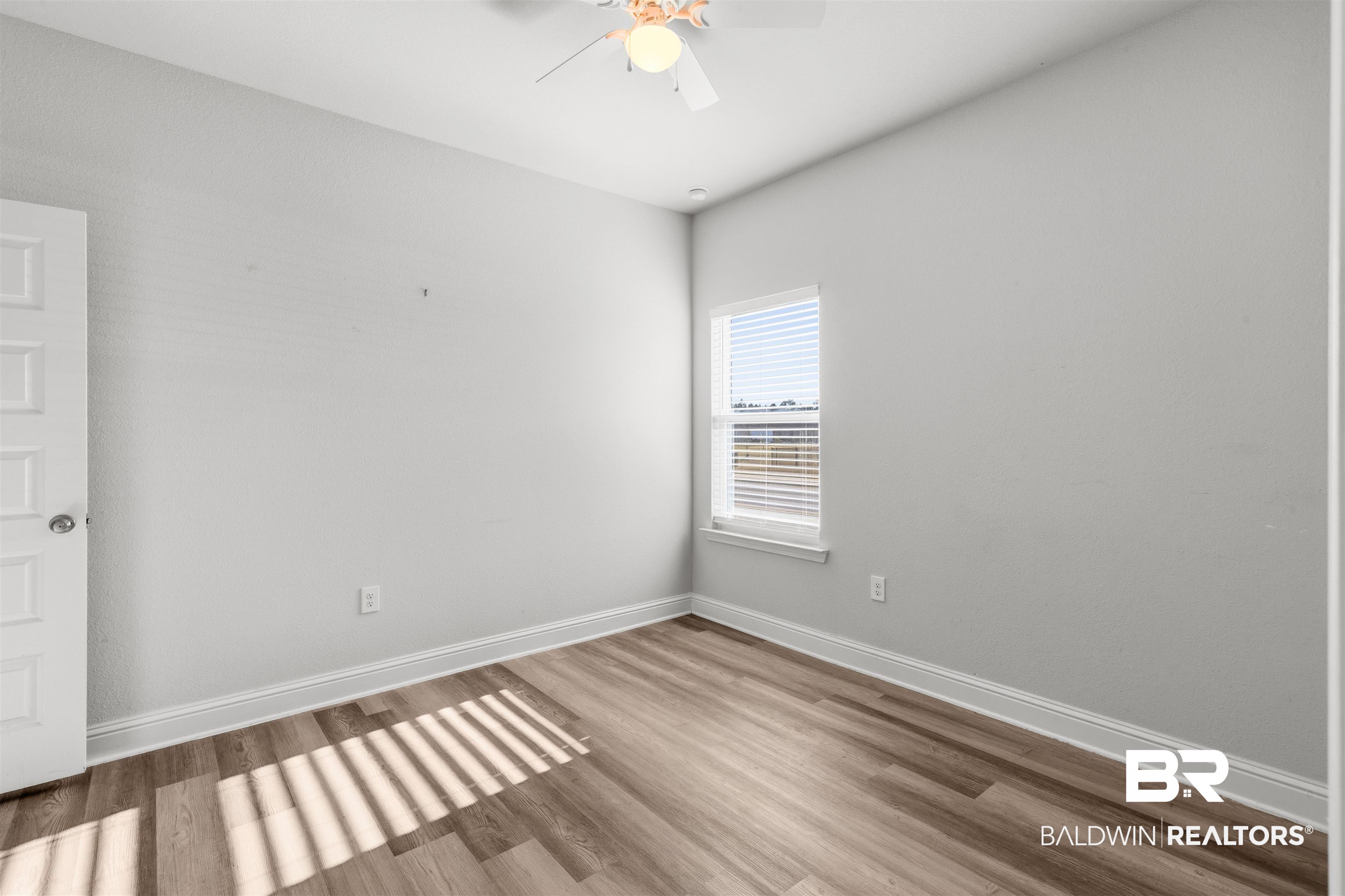 485 Shepard Street Gulf Shores, AL 36542 - Photo 36 of 53 Spare bedroom with wood finished floors and ceiling fan