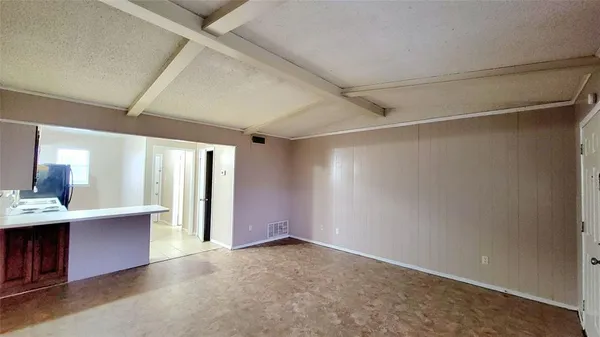 a kitchen with a stove a sink and a refrigerator