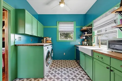 a kitchen with a refrigerator and a sink