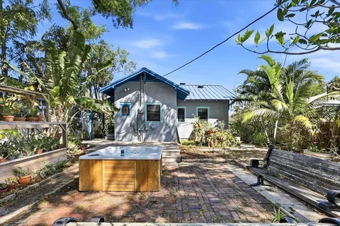 a table and chairs in front of a house