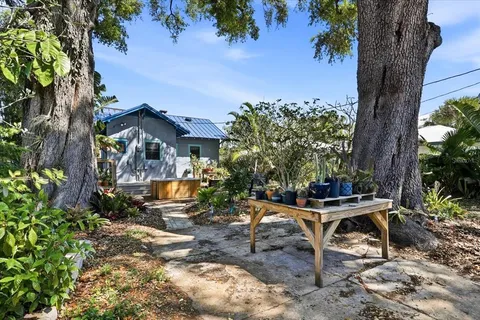 a view of a backyard with sitting area and furniture