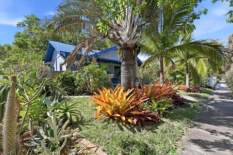a view of a house with a tree