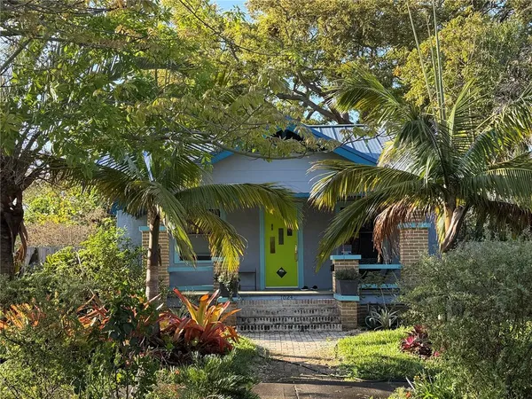 a view of a house with a tree