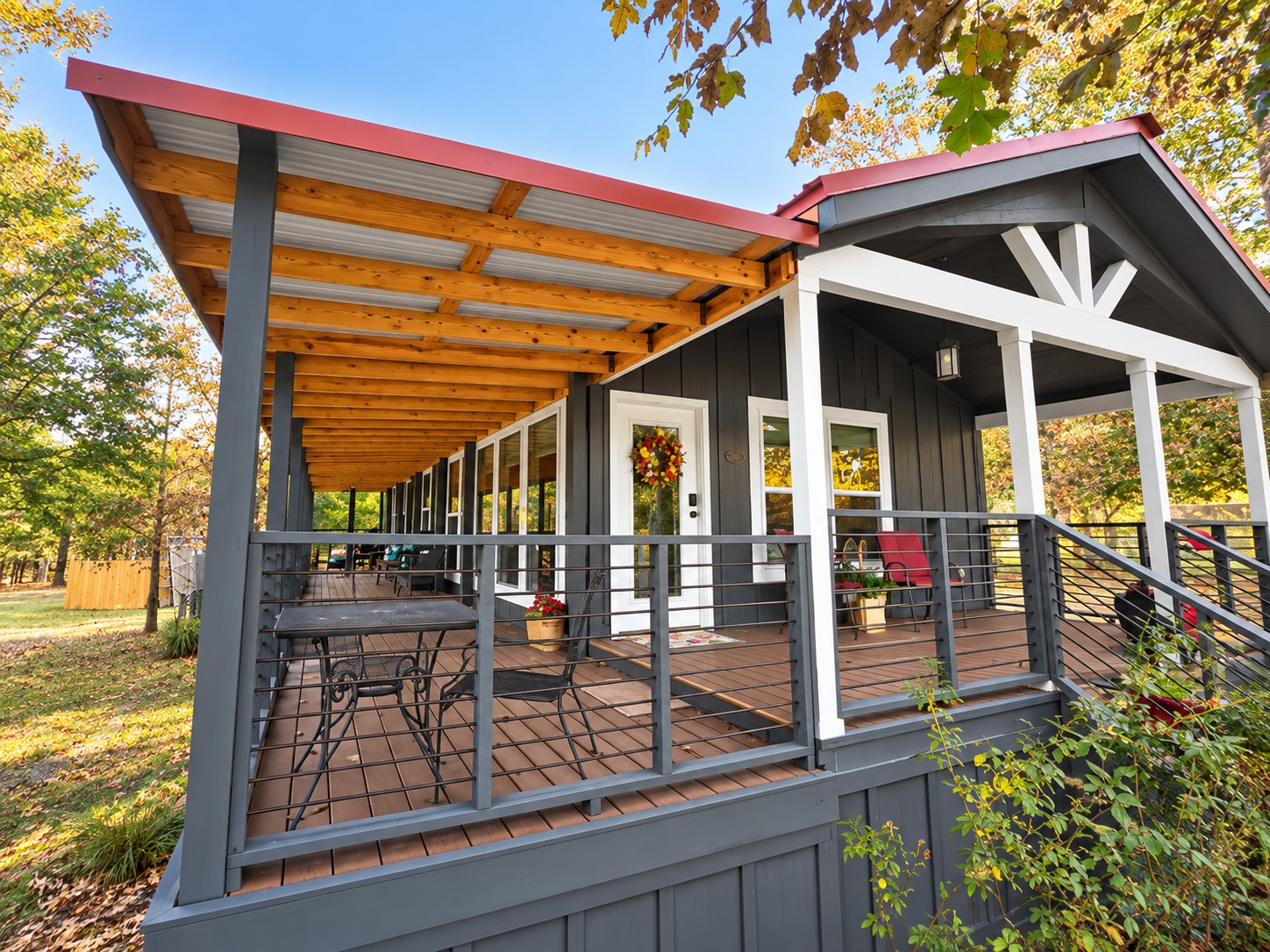 777 Caddo Hills Road Caddo, OK 74729 - Photo 35 of 36 Expansive covered porch with wood-finish decking and metal railings