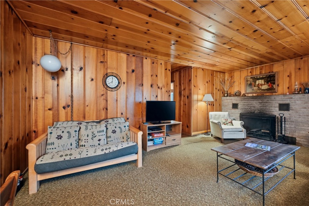 16221 Bottle Rock Road Cobb, CA 95426 - Photo 10 of 21 a living room with furniture and a fireplace