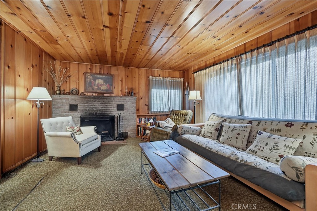 16221 Bottle Rock Road Cobb, CA 95426 - Photo 12 of 21 a living room with furniture and a fireplace