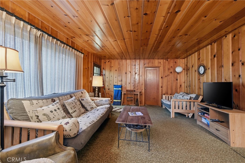 16221 Bottle Rock Road Cobb, CA 95426 - Photo 13 of 21 a living room with furniture and a flat screen tv