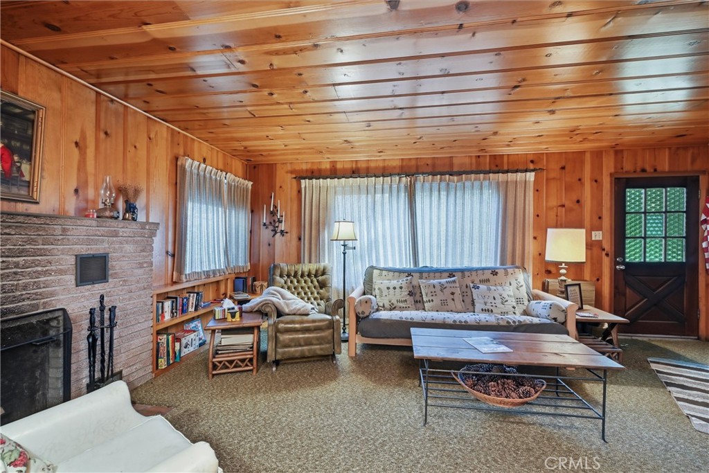 16221 Bottle Rock Road Cobb, CA 95426 - Photo 17 of 21 a living room with furniture and a fireplace