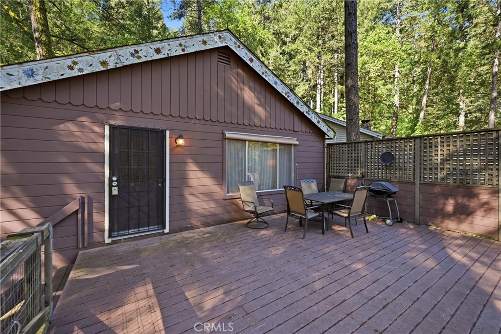 16221 Bottle Rock Road Cobb, CA 95426 - Photo 3 of 21 a backyard of a house with table and chairs