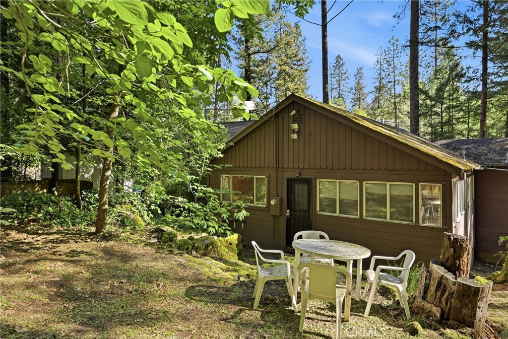 16221 Bottle Rock Road Cobb, CA 95426 - Photo 7 of 21 a backyard of a house with table and chairs