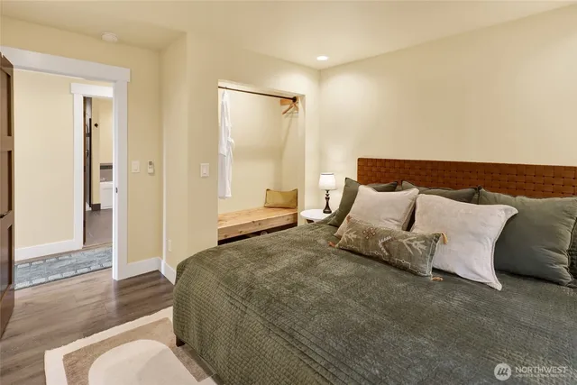 a bedroom with a bed and a couch