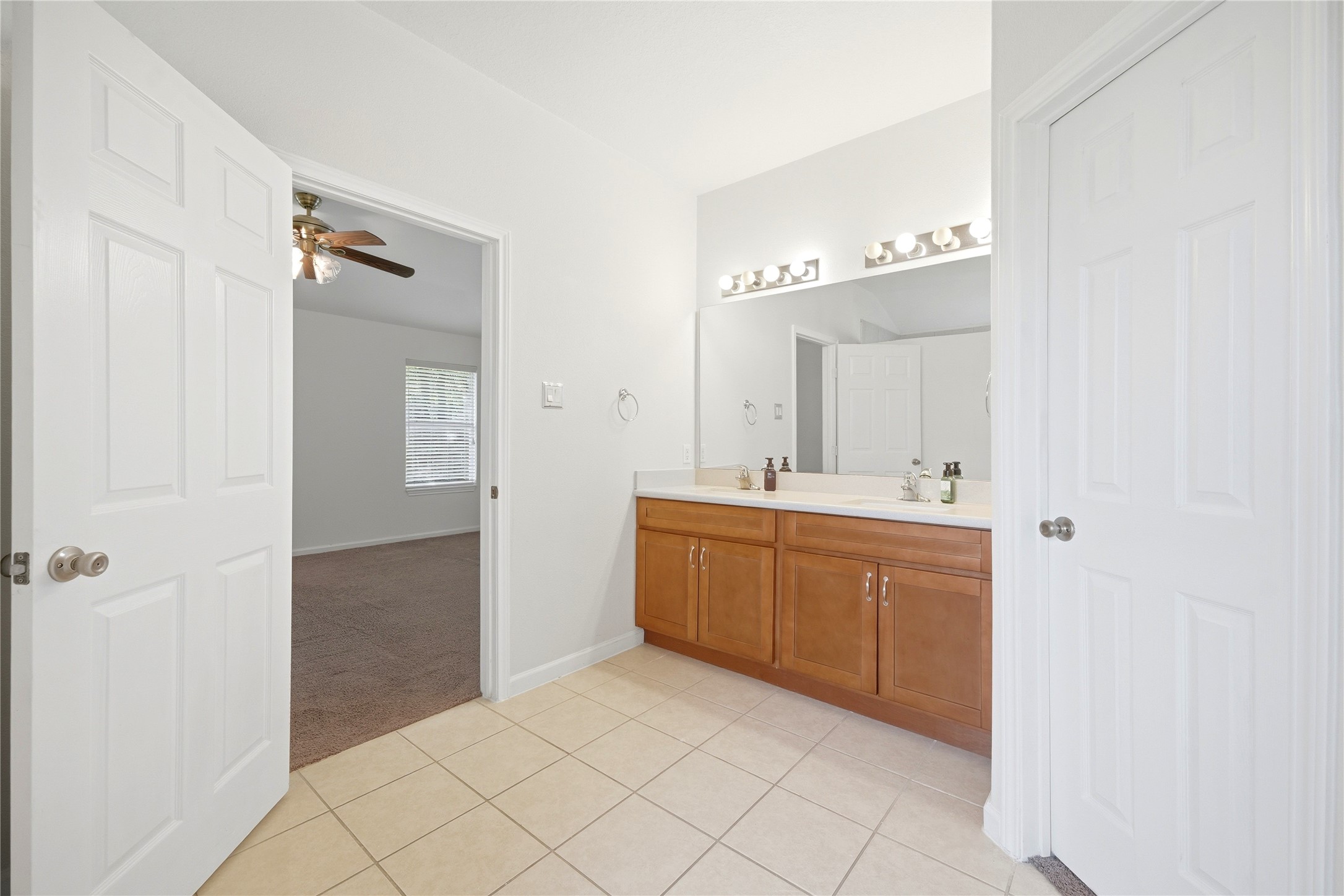 5411 Gate Canyon Court Spring, TX 77373 - Photo 20 of 33 a spacious bathroom with a mirror sink and shower