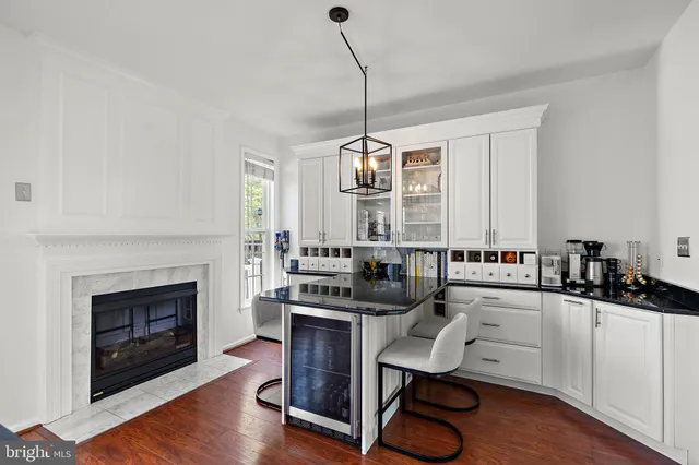 a kitchen with sink cabinets and wooden floor