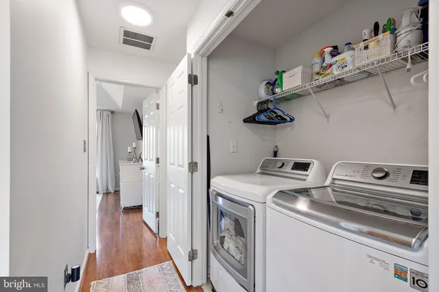 a view of storage and utility room with washer and dryer