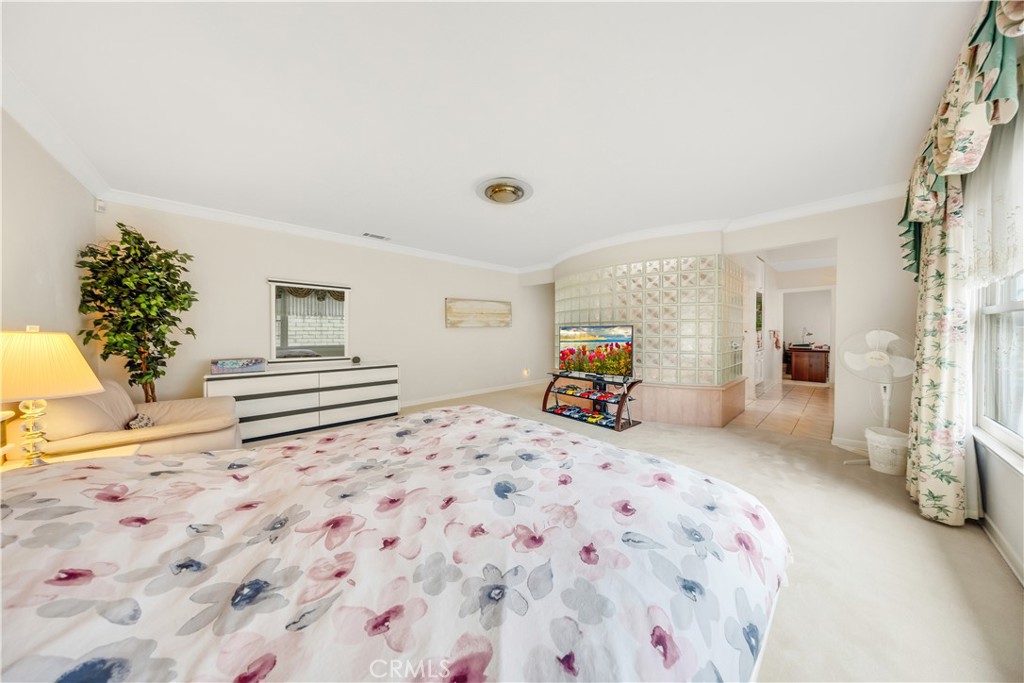2835 Devonport Road San Marino, CA 91108 - Photo 38 of 54 a bedroom with a bed and a chandelier