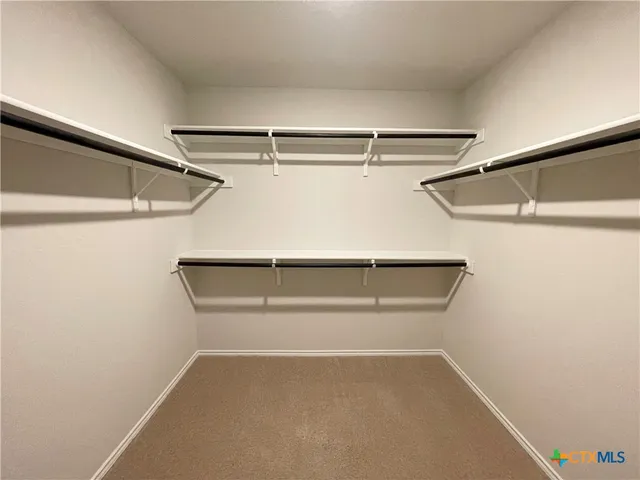 a view of an empty walk in closet
