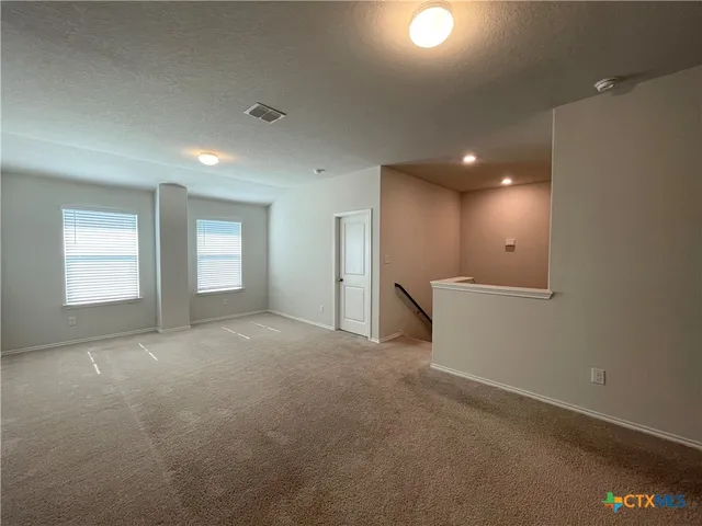 an empty room with a empty space and window