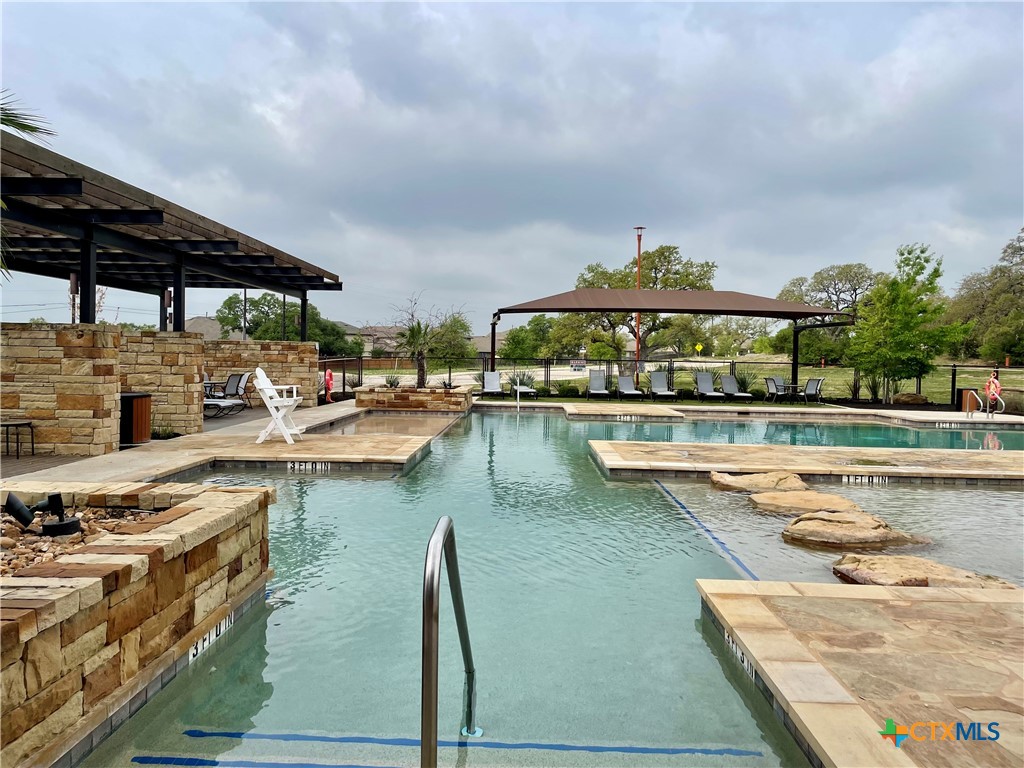 29653 Spring Copper Bulverde, TX 78163 - Photo 25 of 30 a view of a swimming pool with outdoor seating