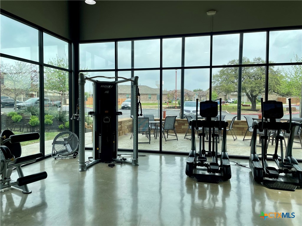 29653 Spring Copper Bulverde, TX 78163 - Photo 29 of 30 a living room with furniture and floor to ceiling window