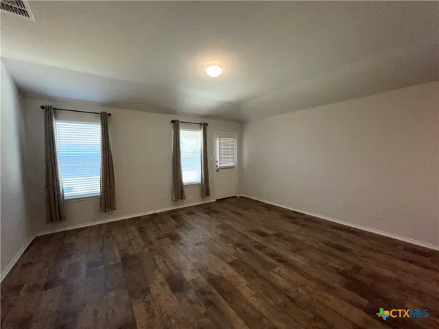 a view of an empty room and window