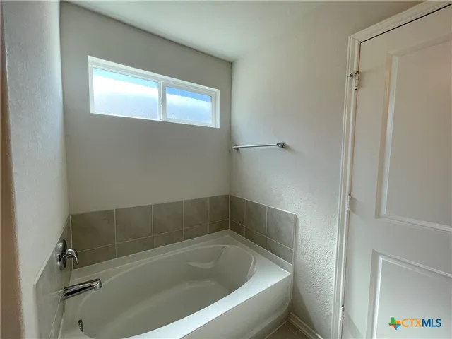 a bathroom with a bathtub